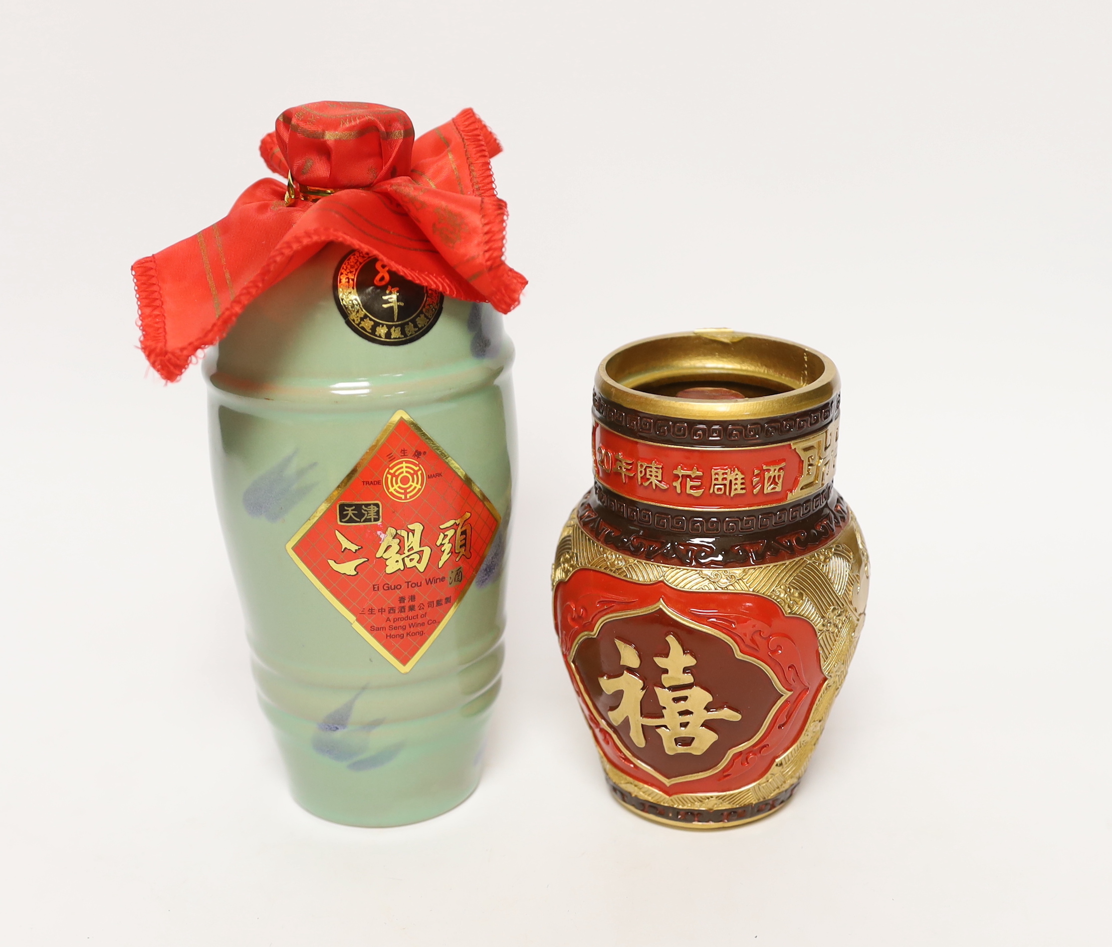 One bottle of Shaoxing Huadiao Jiu Wine, Pagoda Brand Box, 14% Vol, 250ml and one bottle of Ei Guo Ton Wine, Product of Sam Seng Wine Co Hong Kong, PD12/07/25, 56% Vol, 600 ml.